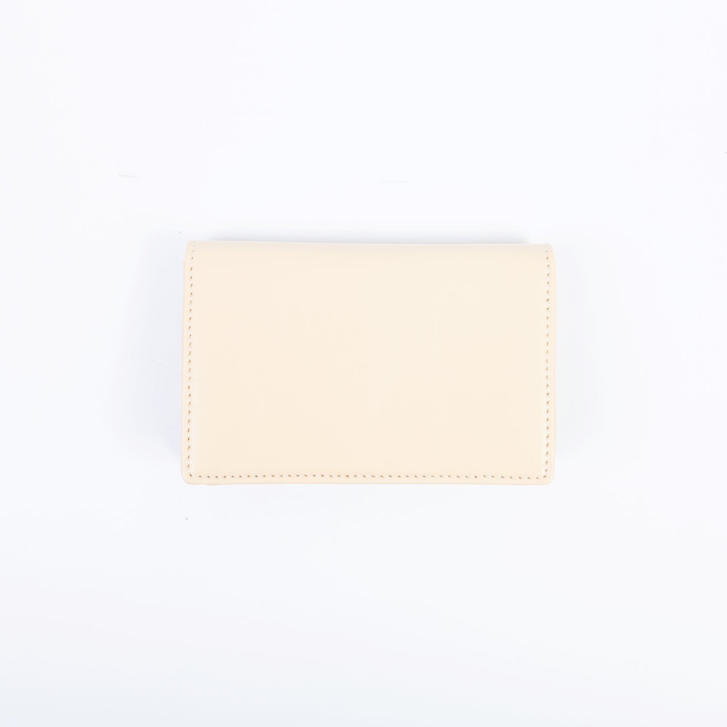Porte-monnaie aux lignes courbes, modèle femme, design vegan et éthique, parfait pour contenir l’essentiel sans compromis.